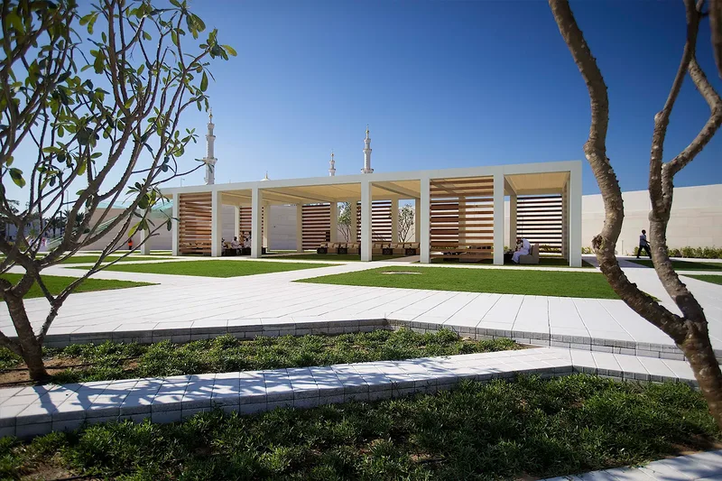 Custom outdoor event structure with landscaped surroundings and guest seating