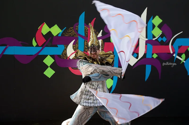 Costumed cultural performer delivering live entertainment at a public event