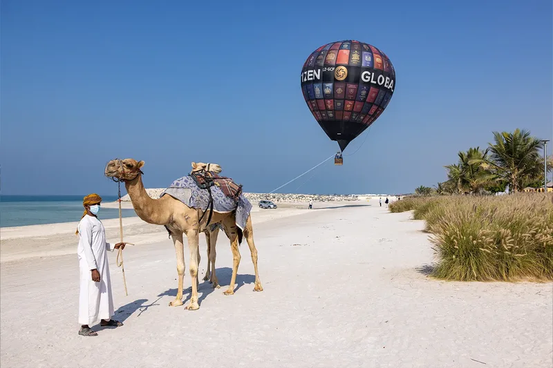 Desert event experience with camels and hot air balloon activation