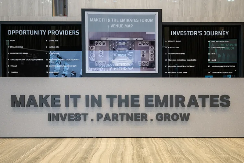 Corporate business event display with branded digital content and guest information