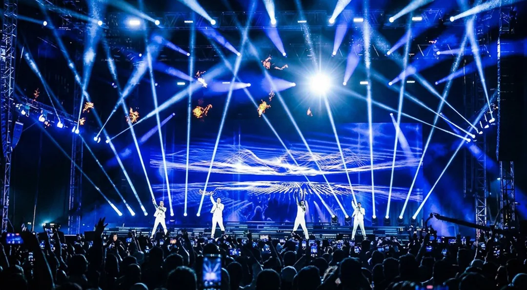 Large-scale event technical production with lighting, staging and live show systems
