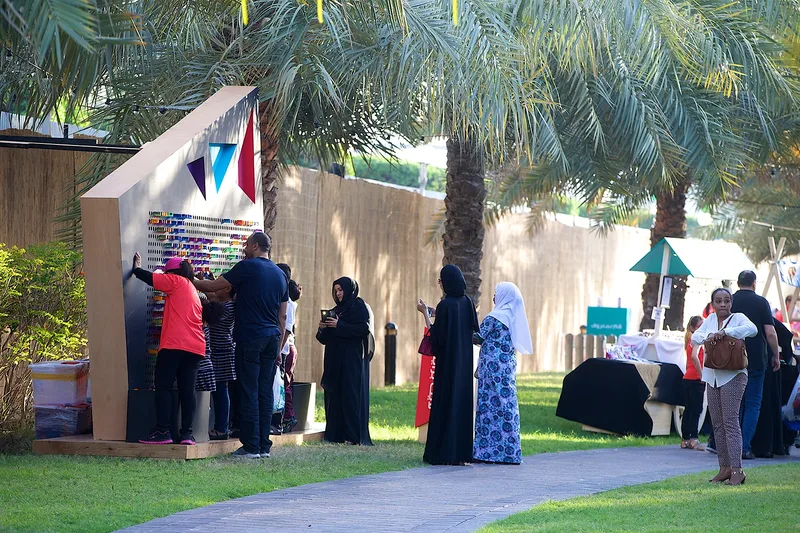 Guests exploring outdoor festival activations at Mother of the Nation Festival Abu Dhabi