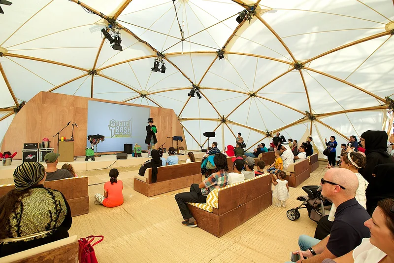 Family hospitality and activity area beneath a geodesic structure at Mother of the Nation Festival