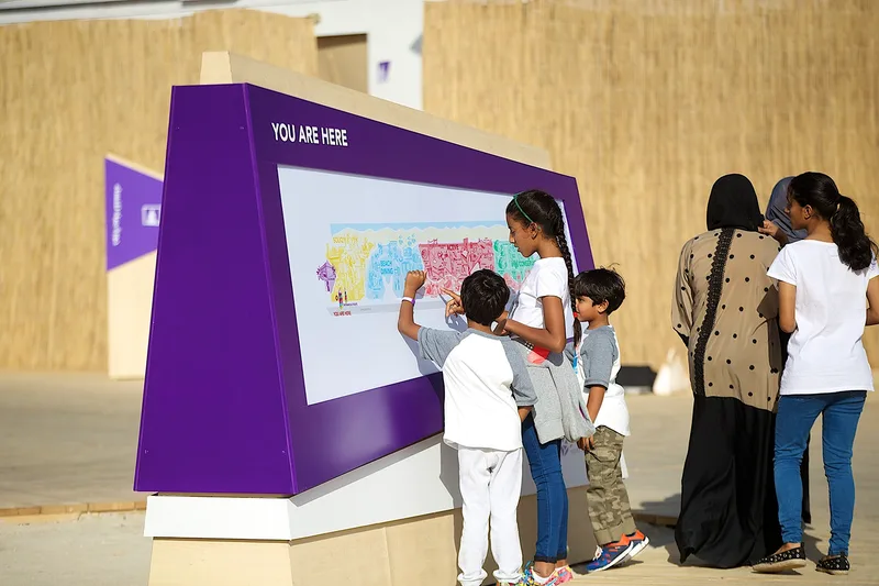 Children using an interactive digital installation at Mother of the Nation Festival