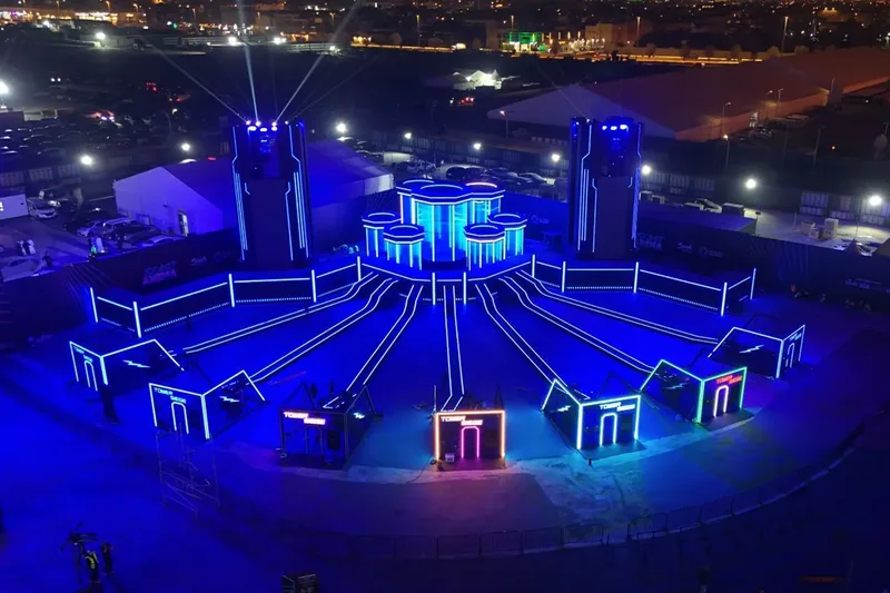 Large-scale live event arena with immersive lighting and stage production
