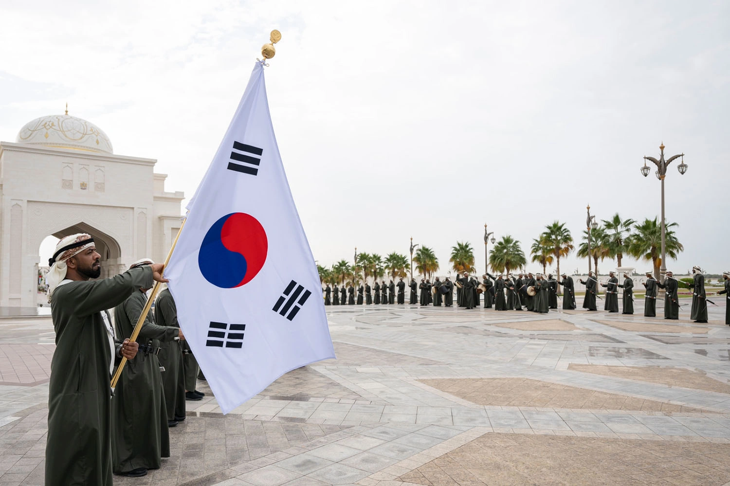 South Korean flag and traditional Emirati performers during the South Korea State Visit in Abu Dhabi