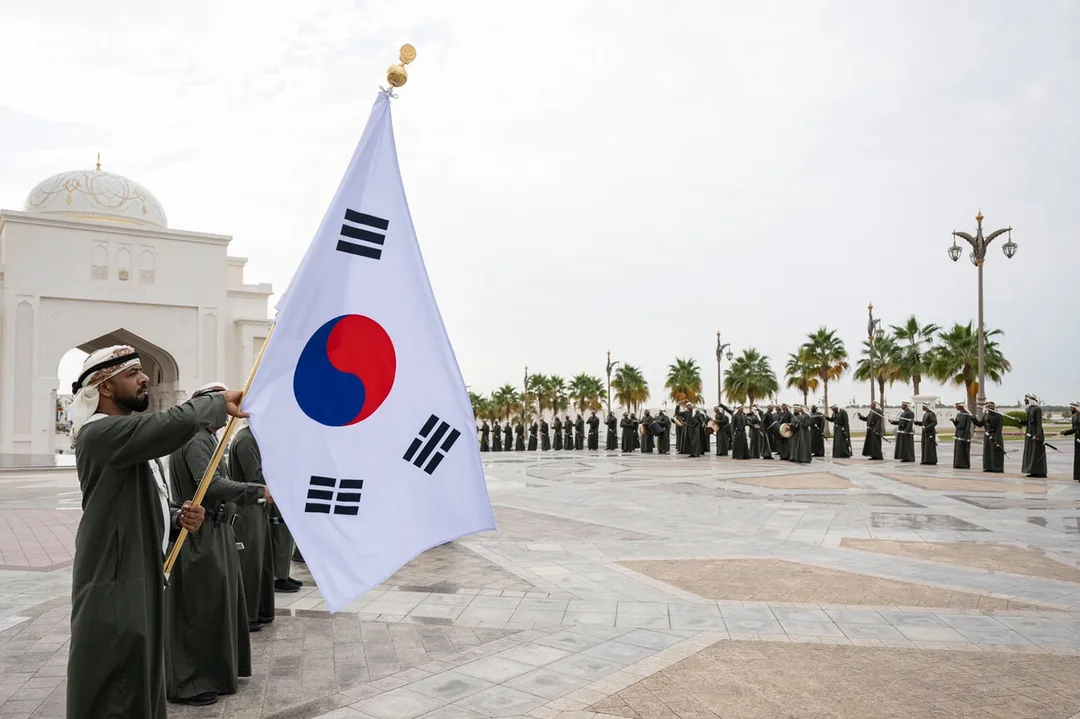 South Korean flag and traditional Emirati performers during the South Korea State Visit in Abu Dhabi